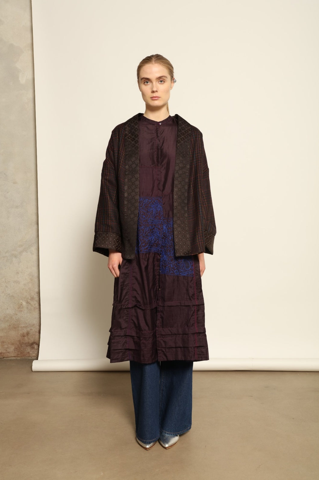 Model is wearing the Harmony Kantha Jacket by Obidi, made from reused sari fabric with traditional kantha hand-stitching, combining heritage craftsmanship with a contemporary silhouette.
