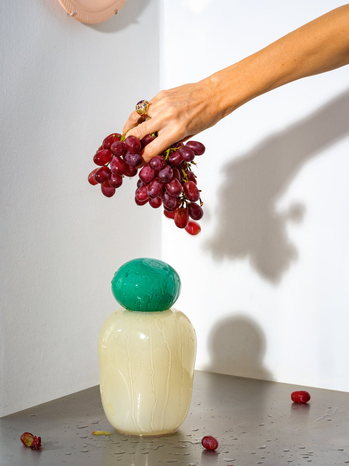 Bon Bon Medi by Helle Mardahl Studio in Spearmint and Champagne, handmade sculptural glass vase with removable lid, available at House of Nomad Stories.