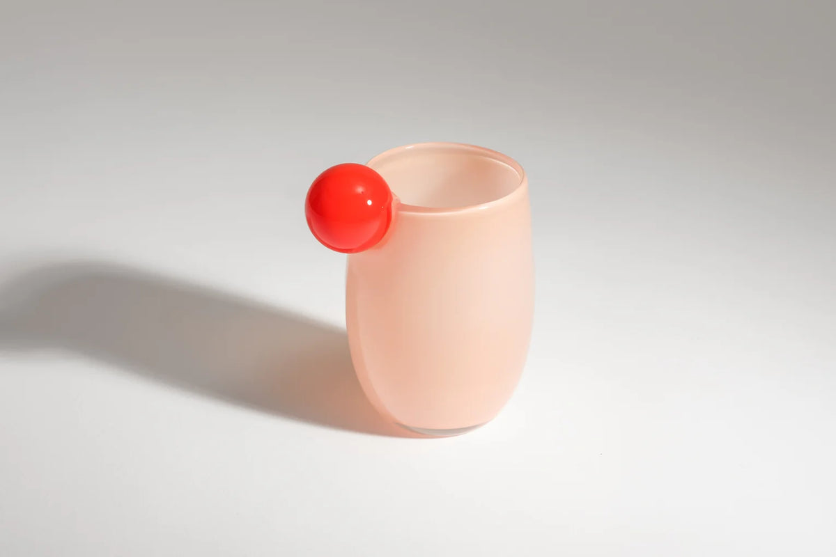 The Cup Mega by Helle Mardahl Studio in Grapefruit and Apricot, handmade glossy glass cup with rounded silhouette and vibrant colours from House of Nomad Stories.