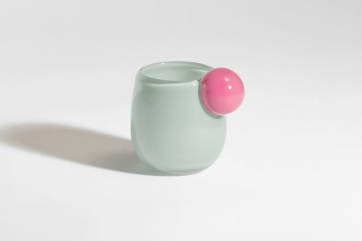 The Cup Mini by Helle Mardahl Studio in Pink and Mint, petite handmade glossy glass cup with delicate silhouette and playful colours from House of Nomad Stories.