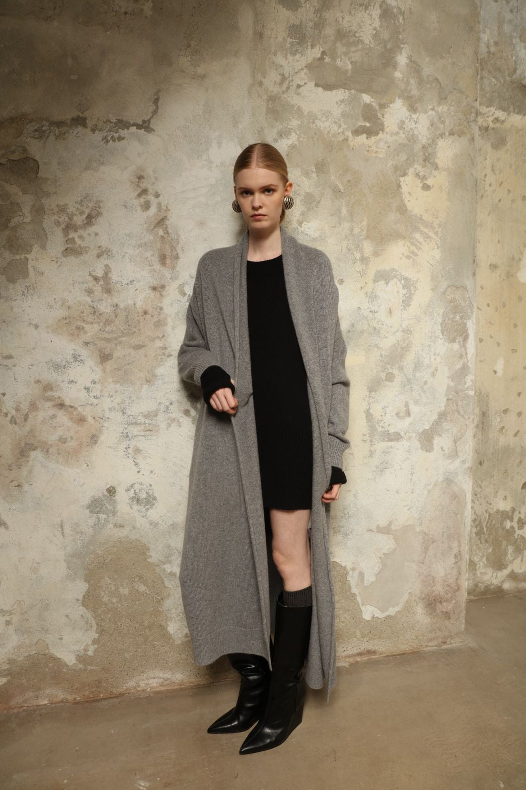 Model is wearing the Graphite Paula Cashmere Coat by House of Woven Stories, a pure ethically sourced cashmere coat in deep graphite with fluid open-front silhouette and refined soft drape.