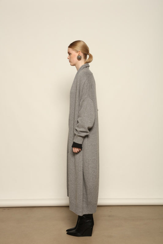 Model is wearing the Graphite Paula Cashmere Coat by House of Woven Stories, a pure ethically sourced cashmere coat in deep graphite with fluid open-front silhouette and refined soft drape.