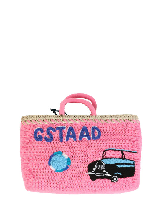 Diamond & Rolls Undercover basket bag by Kilometre Paris, curated by House of Woven Stories, featuring pink crochet, blue Gstaad lettering and vintage car embroidery on handwoven straw, inspired by winter glamour and travel