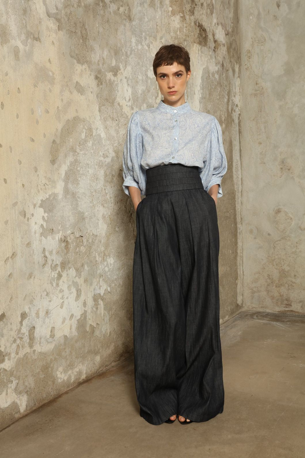 Model wearing the Lola Paisley Blouse by House of Woven Stories, featuring 100% linen fabric, delicate paisley print, relaxed silhouette, and lightweight breathable summer design.