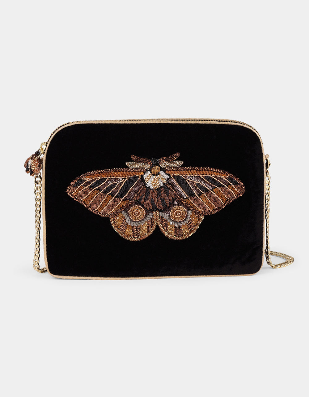 Olivia Dar Nebelia Black Velvet Sling Bag by House of Woven Stories, featuring a hand-embroidered moth motif in bronze, gold and silver, embellished with pearls and sequins, and a removable chain strap for shoulder or crossbody wear.