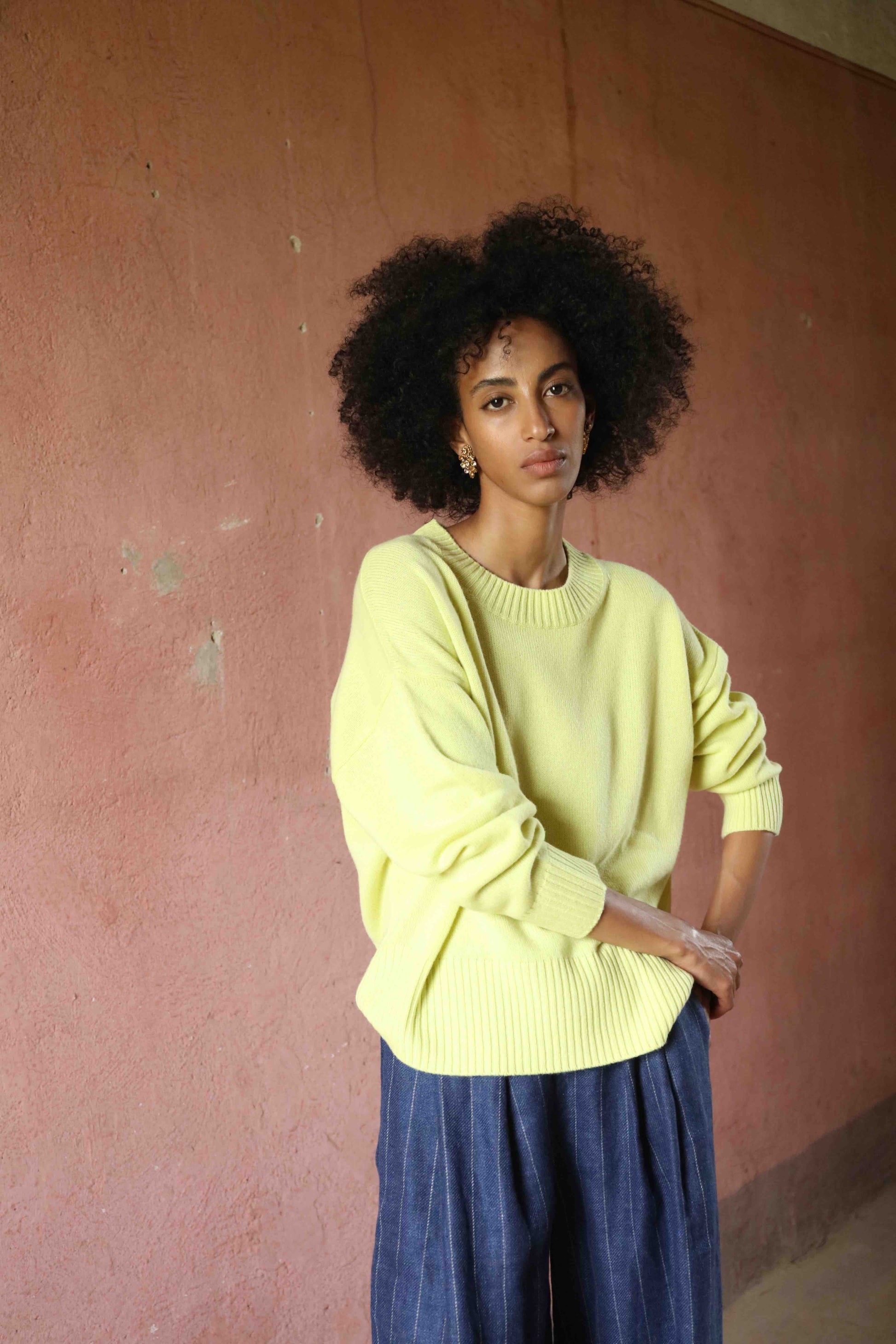 Nena Round Neck Sweater by House of Woven Stories 100% pure, undyed Inner Mongolian cashmere. Soft, breathable, handcrafted in natural tones. Relaxed fit with ribbed trims. Sustainable luxury knitwear.