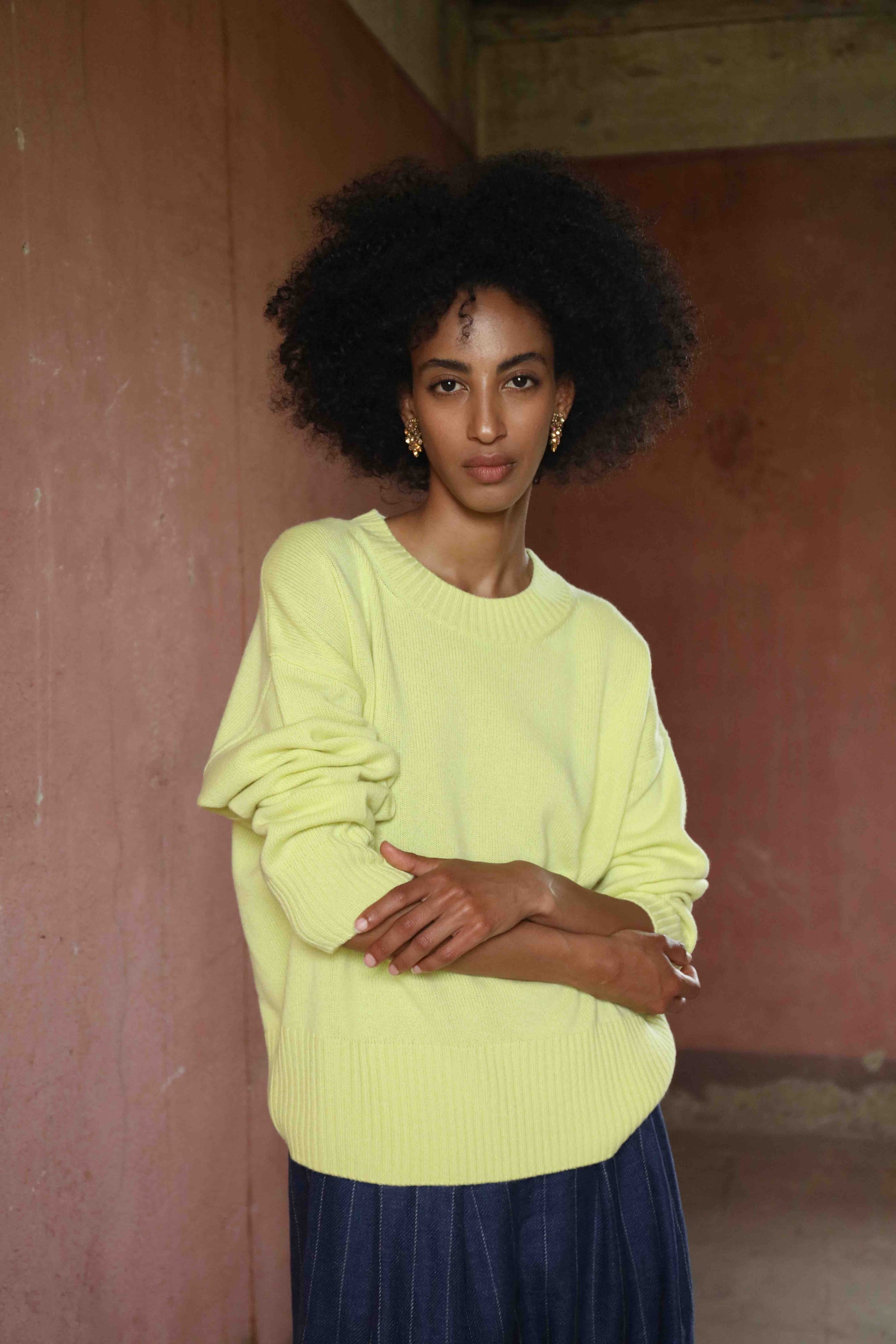 Nena Round Neck Sweater by House of Woven Stories 100% pure, undyed Inner Mongolian cashmere. Soft, breathable, handcrafted in natural tones. Relaxed fit with ribbed trims. Sustainable luxury knitwear.