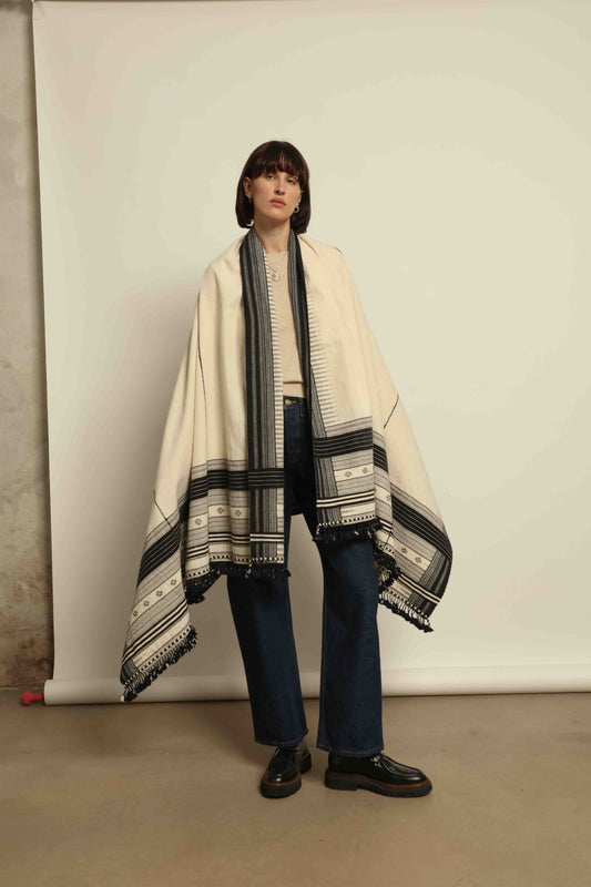 Handwoven Kala cotton throw Ananta by House of Woven Stories, crafted with handspun yarn and embroidered panels by master weaver Shamji Vankar Vishram Valji in Bhujodi, India.