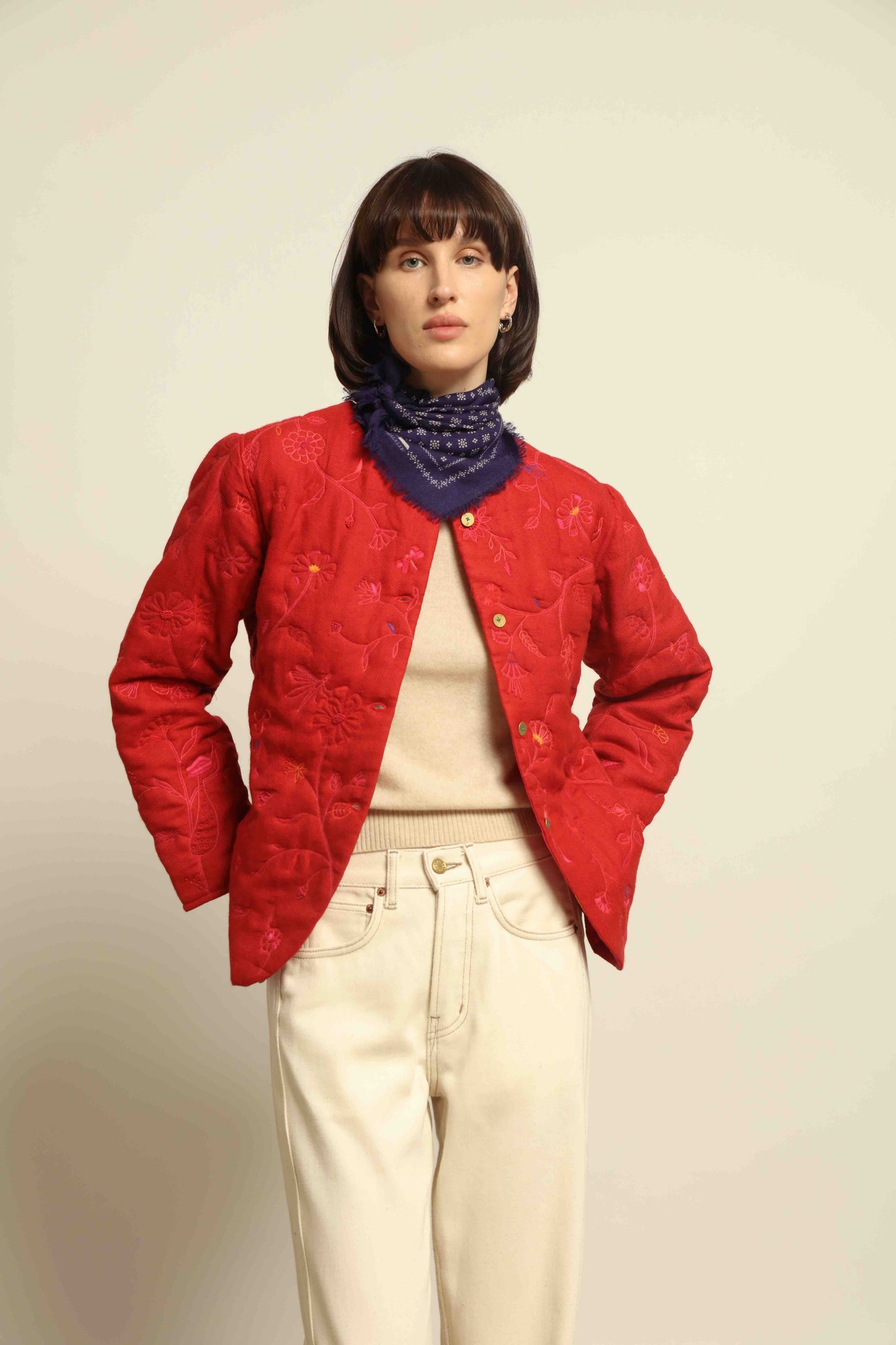 Model is wearing the Folklore 58 Jacket by Injiri, handloomed in scarlet red silk and wool with a lightweight yet structured cut, combining tradition and modern elegance.
