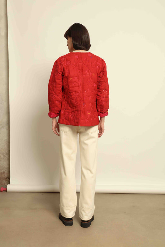 Model is wearing the Folklore 58 Jacket by Injiri, handloomed in scarlet red silk and wool with a lightweight yet structured cut, combining tradition and modern elegance.