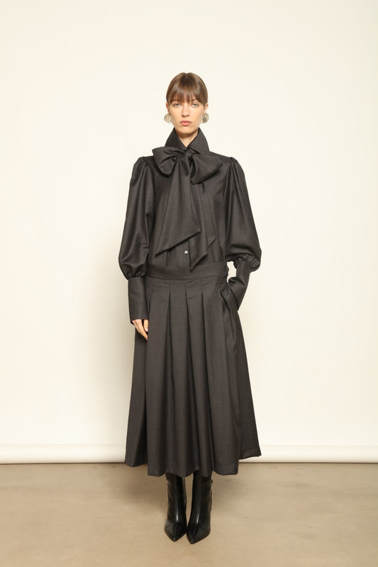 Larissa Super 100% Merino Wool Skirt by House of Woven Stories – midi-length pleated skirt in soft, luxurious merino wool, tailored in Piemonte, Italy for timeless elegance and comfort.