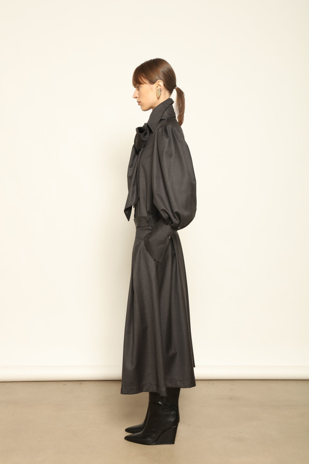 Larissa Super 100% Merino Wool Skirt by House of Woven Stories – midi-length pleated skirt in soft, luxurious merino wool, tailored in Piemonte, Italy for timeless elegance and comfort.