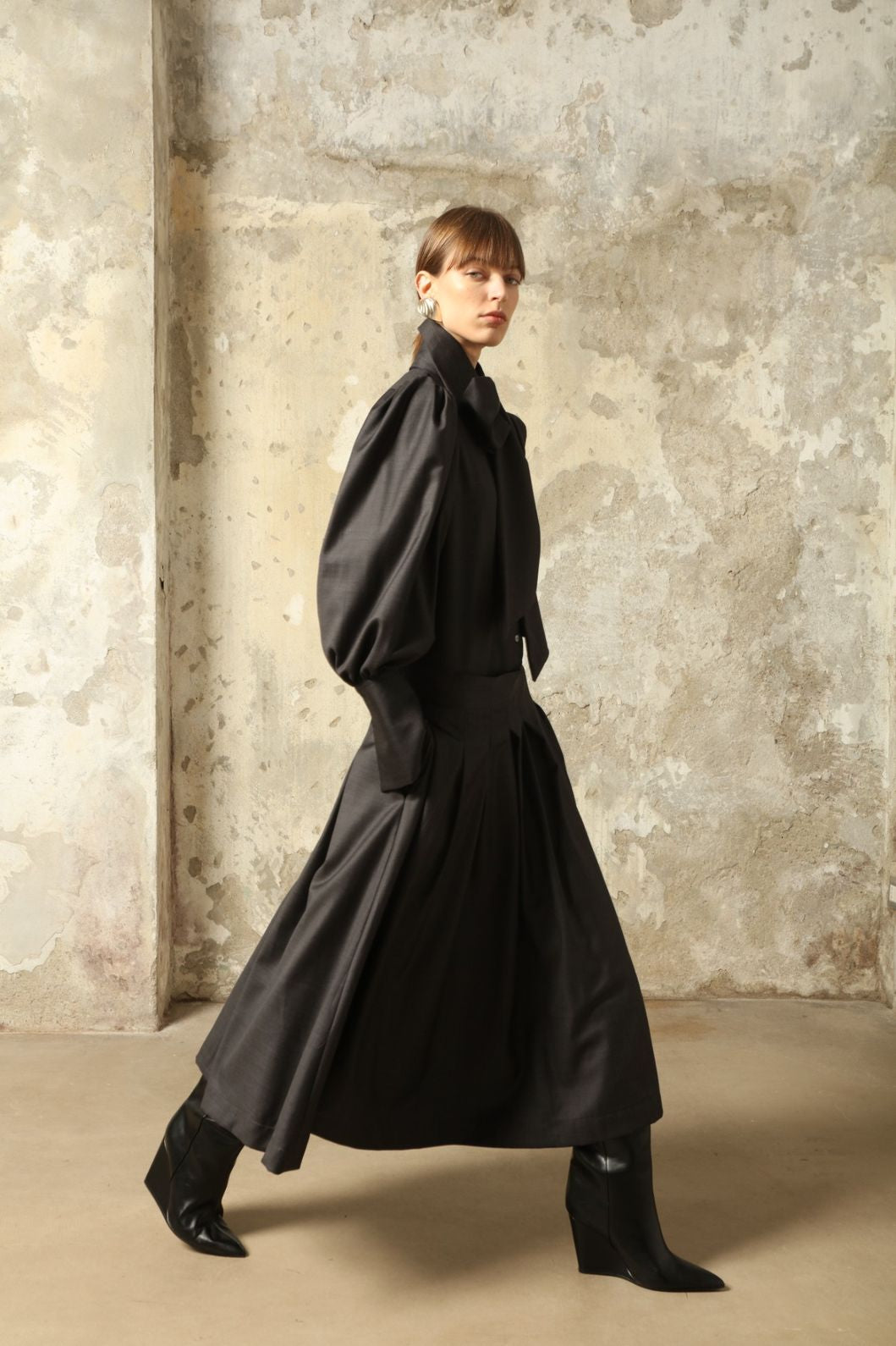 Larissa Super 100% Merino Wool Skirt by House of Woven Stories – midi-length pleated skirt in soft, luxurious merino wool, tailored in Piemonte, Italy for timeless elegance and comfort.