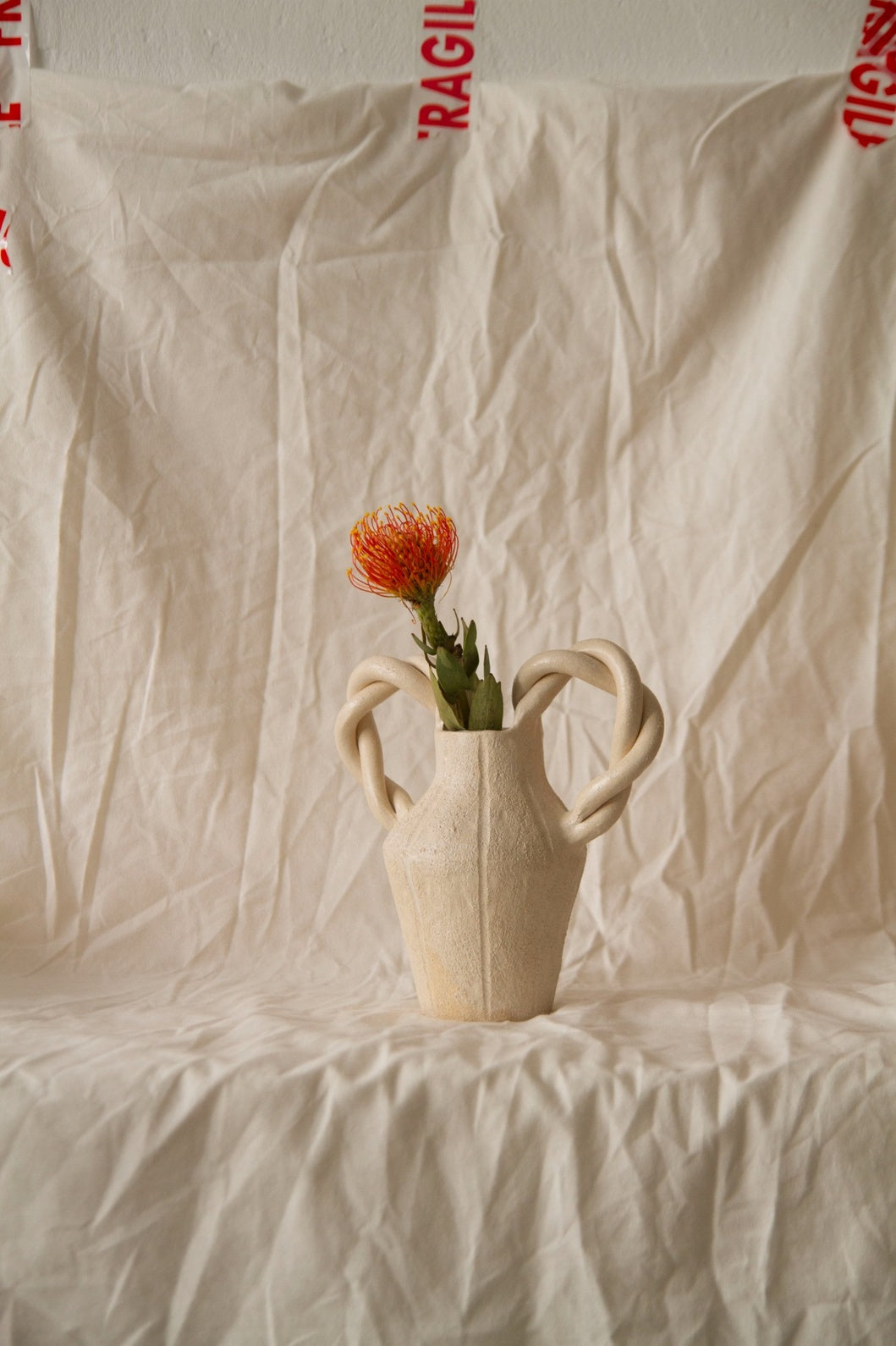 Le Petit Tressé by Clandestine Céramique, handmade in natural chamotte clay with twisted handles and engraved vertical stripes, part of the House of Woven Stories selection.