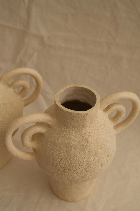 L’Enfant Lune aux Doubles Anses by Clandestine Céramique, handbuilt in sandy clay with double curving handles and soft glaze, part of the House of Woven Stories selection.