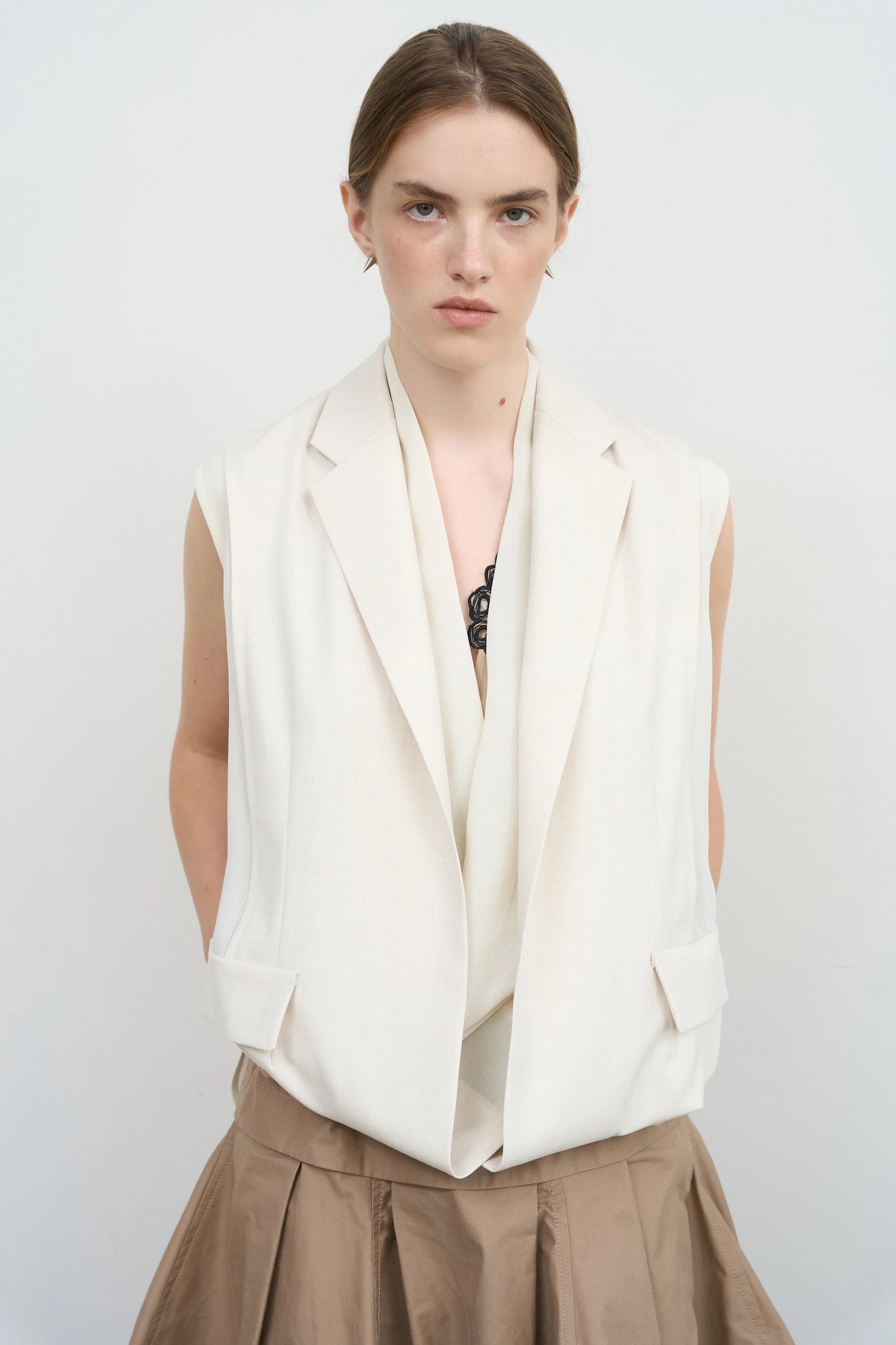 Layered Tucked Hem Vest by Litkovska, contemporary tailored vest with sculptural layered hem, relaxed fit and architectural silhouette.