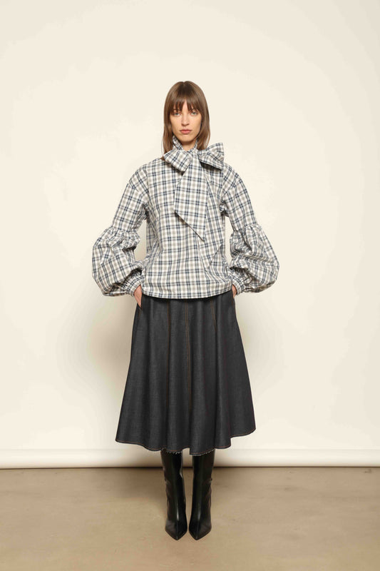 Model wearing Lulu Maxi Check Popeline Cotton Blouse with Scarf by House of Woven Stories, featuring balloon sleeves, grey-white-indigo check, and versatile scarf detail.