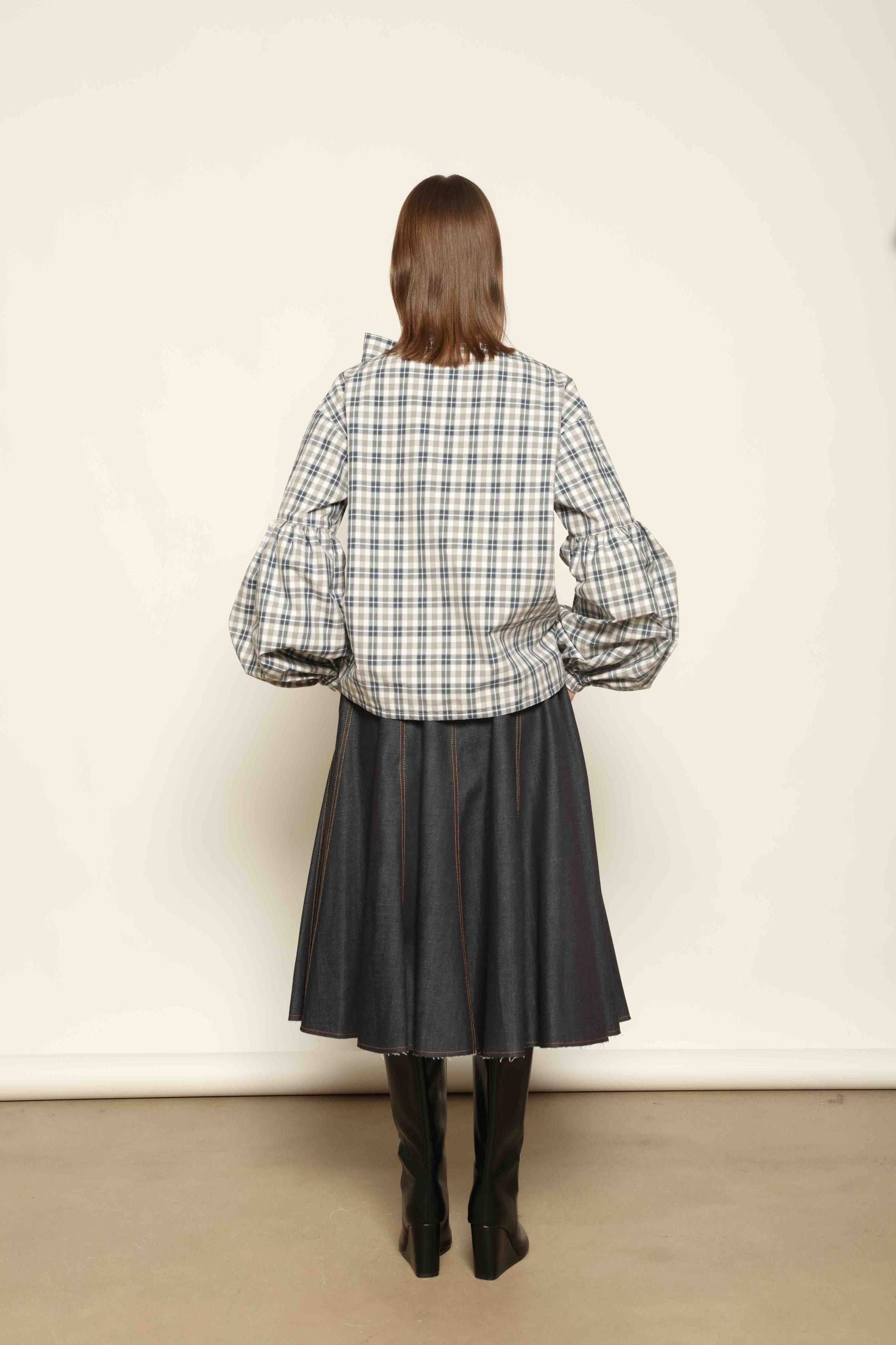 Model wearing Lulu Maxi Check Popeline Cotton Blouse with Scarf by House of Woven Stories, featuring balloon sleeves, grey-white-indigo check, and versatile scarf detail.