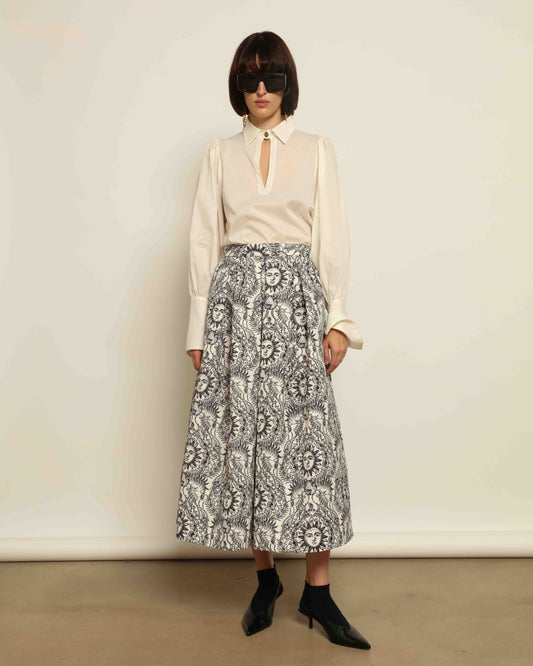 Model is wearing Sun Black and White Skirt by Lunatica Milano. Romantic floral skirt in classic black and white. Elegant, feminine, and handcrafted in Italy. Part of House of Woven Stories selection.