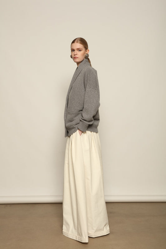 Model is wearing the Birkin Cream Velvet Pant by Maison Jejia, soft cream velvet trousers with a relaxed refined fit and gentle shine, curated in the House of Woven Stories selection
