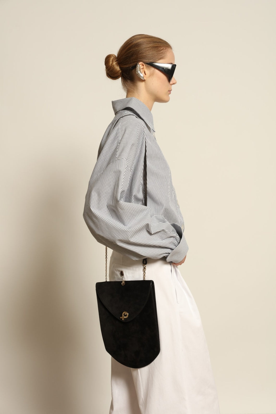 Model is wearing the Katherine White A-Line Pant by Maison Jejia, structured cotton trousers with an elongating A-line silhouette, curated in the House of Woven Stories selection.