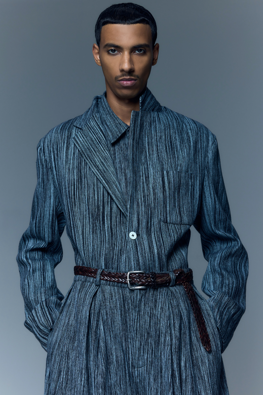 Model is wearing the Grey Chambray Blazer by Marrakshi Life, a hand-woven chambray cotton blazer with an elongated relaxed fit, notched collar and front buttons, curated in the House of Woven Stories selection.