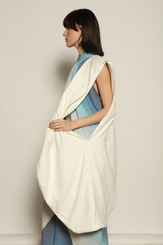 Model is wearing Marrakshi Life beach bag in handwoven cotton, lightweight spacious versatile tote from the curated selection of House of Woven Stories