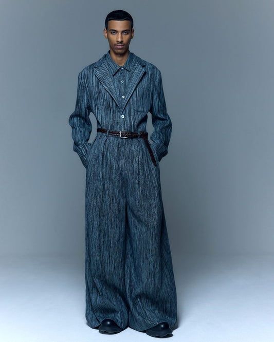 Model is wearing the Grey Chambray Blazer by Marrakshi Life, a hand-woven chambray cotton blazer with an elongated relaxed fit, notched collar and front buttons, curated in the House of Woven Stories selection.