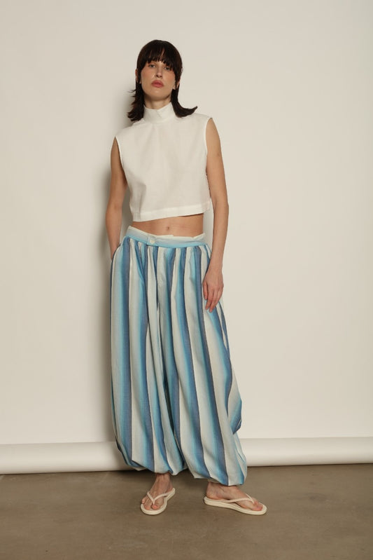 Model is wearing Marrakshi Life harem pants in striped handwoven cotton, voluminous relaxed fit lightweight breathable trousers from the curated selection of House of Woven Stories