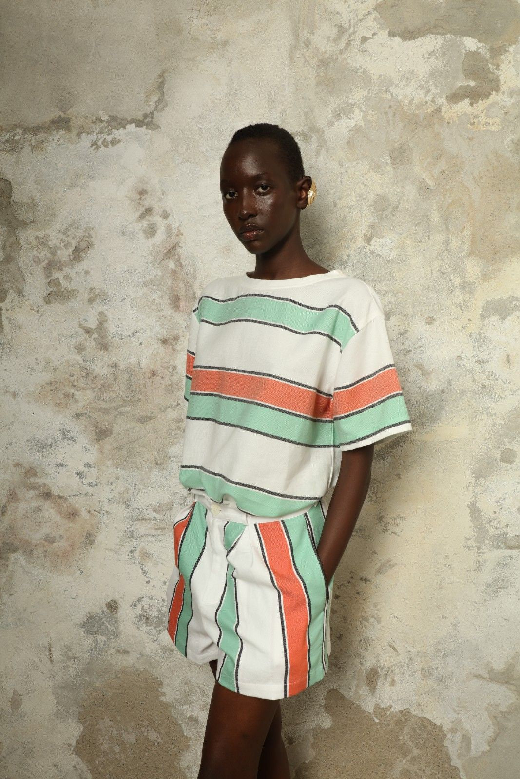 Tennis Dress Stripe 02 by House of Woven Stories, handwoven natural fibre dress with striped pattern, structured silhouette and modern sporty elegance.