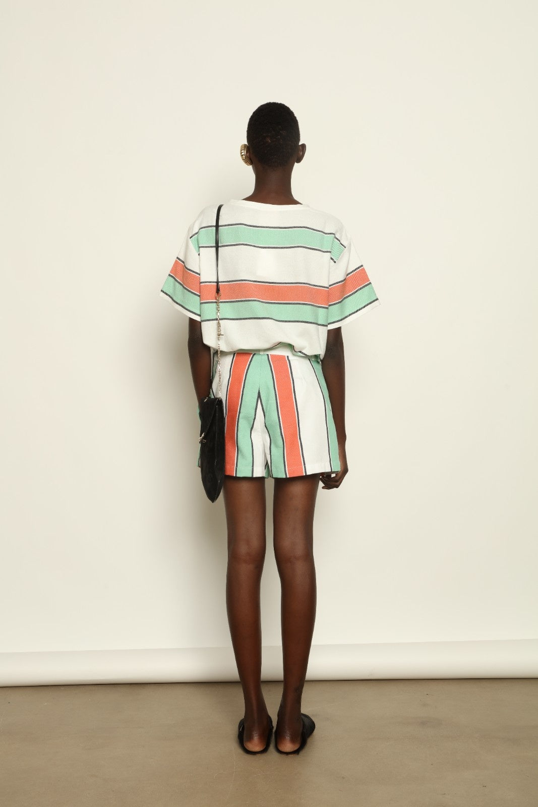 Tennis Dress Stripe 02 by House of Woven Stories, handwoven natural fibre dress with striped pattern, structured silhouette and modern sporty elegance.