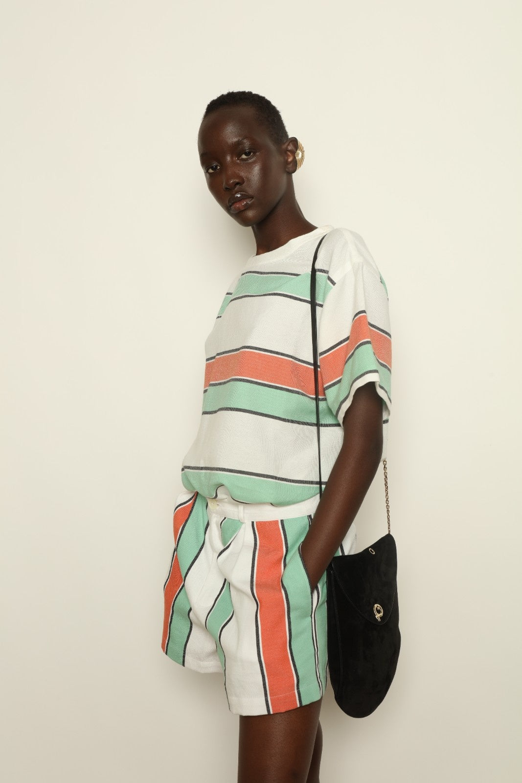 Tennis Dress Stripe 02 by House of Woven Stories, handwoven natural fibre dress with striped pattern, structured silhouette and modern sporty elegance.