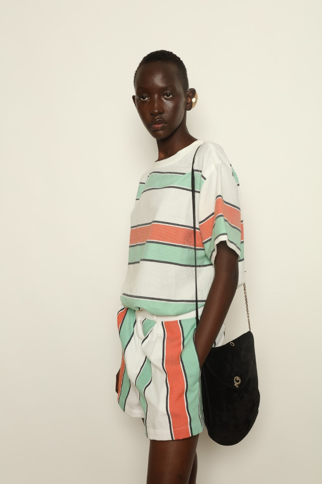 Tennis Dress Stripe 02 by House of Woven Stories, handwoven natural fibre dress with striped pattern, structured silhouette and modern sporty elegance.
