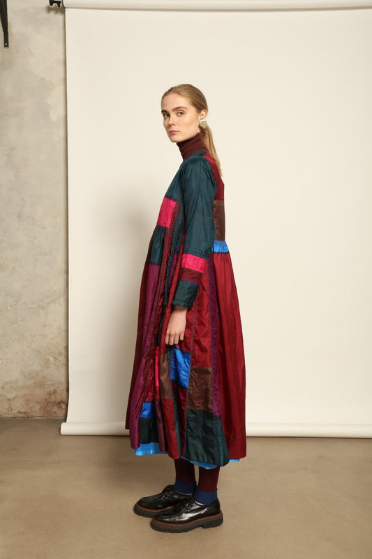 Model is wearing the Miraj 127 Silk Dress by Injiri, handwoven in India from pure silk with a fluid silhouette, soft sheen, and refined artisanal details for timeless elegance.