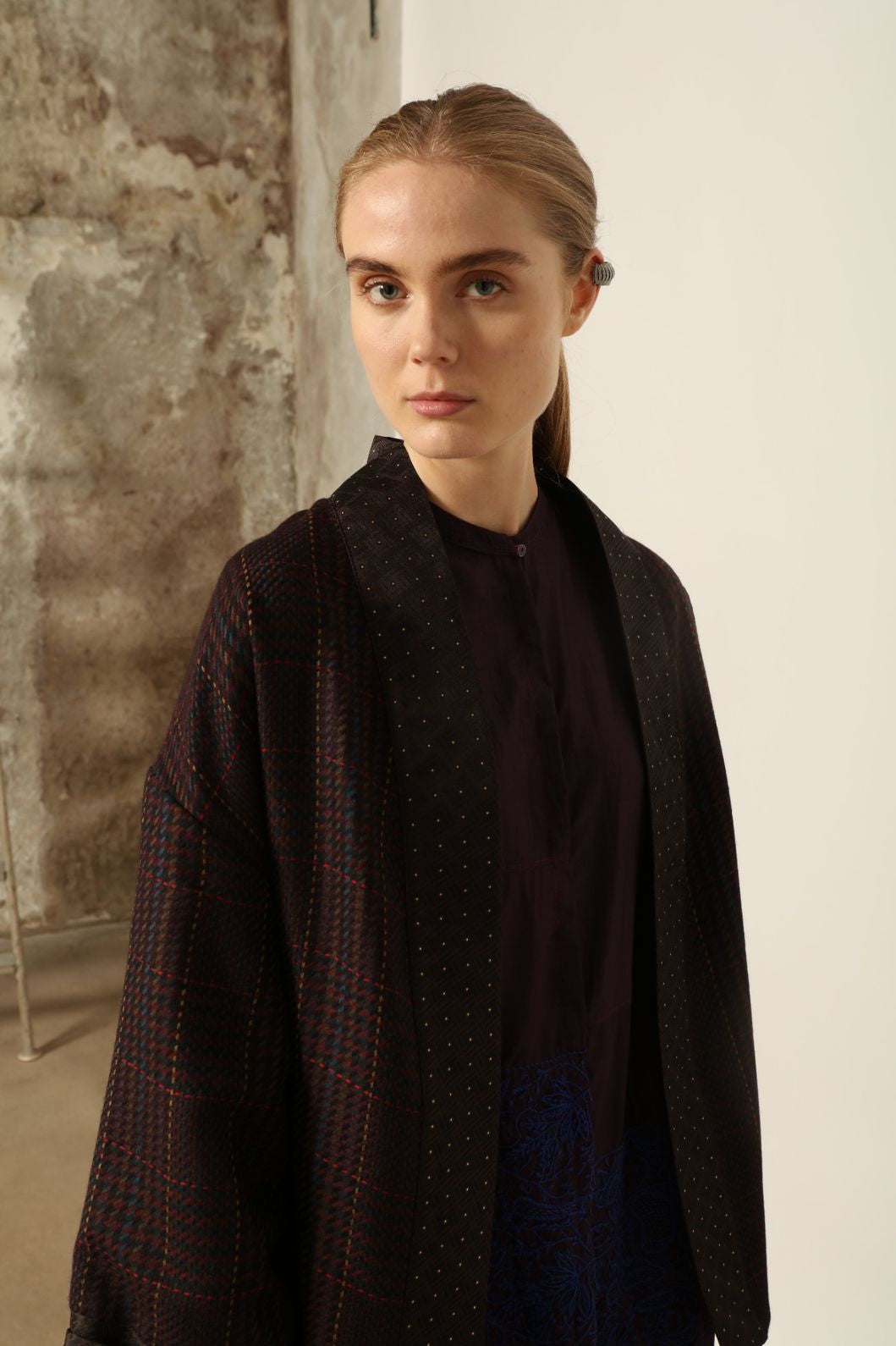 Model is wearing the Miraj 121 Pure Silk Dress by Injiri, handcrafted in maroon silk with detailed navy hand embroidery, showcasing Indian craftsmanship and refined elegance.