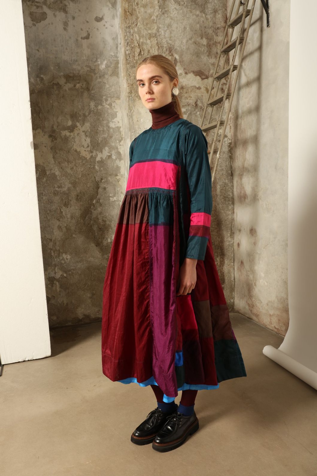 Model is wearing the Miraj 127 Silk Dress by Injiri, handwoven in India from pure silk with a fluid silhouette, soft sheen, and refined artisanal details for timeless elegance.
