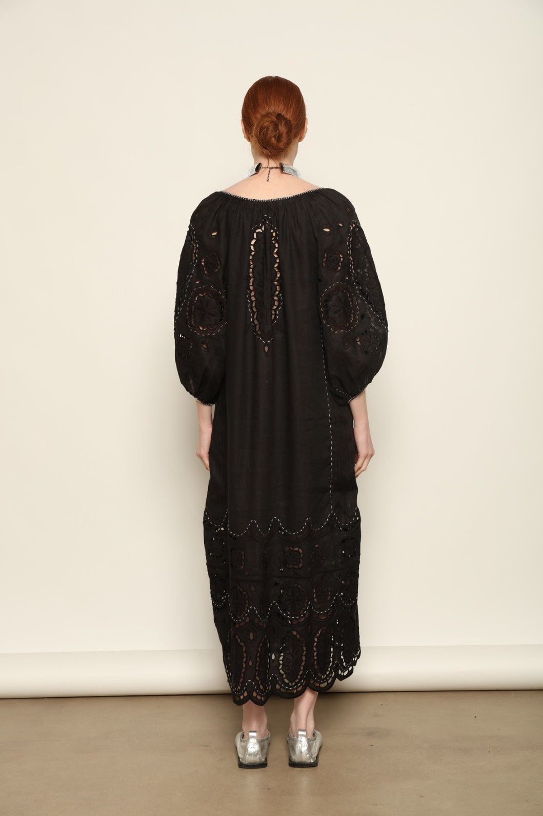 Model is wearing the My Sleeping Gypsy Merezhivo Long Dress, handcrafted from 100% linen with Richelieu embroidery and 24-carat bead accents, from the House of Nomad Stories selection.