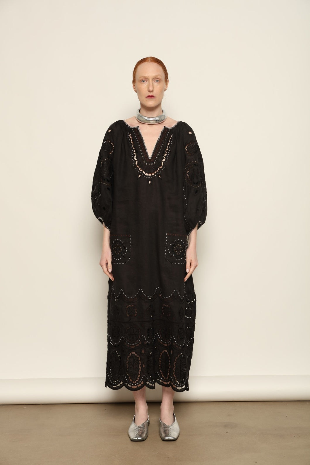 Model is wearing the My Sleeping Gypsy Merezhivo Long Dress, handcrafted from 100% linen with Richelieu embroidery and 24-carat bead accents, from the House of Nomad Stories selection.