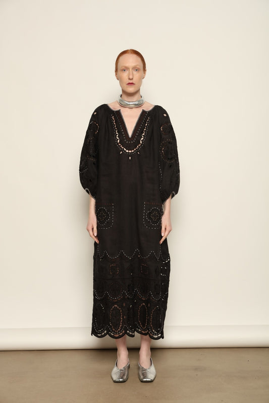 Model is wearing the My Sleeping Gypsy Merezhivo Long Dress, handcrafted from 100% linen with Richelieu embroidery and 24-carat bead accents, from the House of Nomad Stories selection.