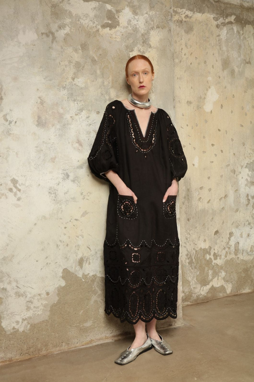Model is wearing the My Sleeping Gypsy Merezhivo Long Dress, handcrafted from 100% linen with Richelieu embroidery and 24-carat bead accents, from the House of Nomad Stories selection.