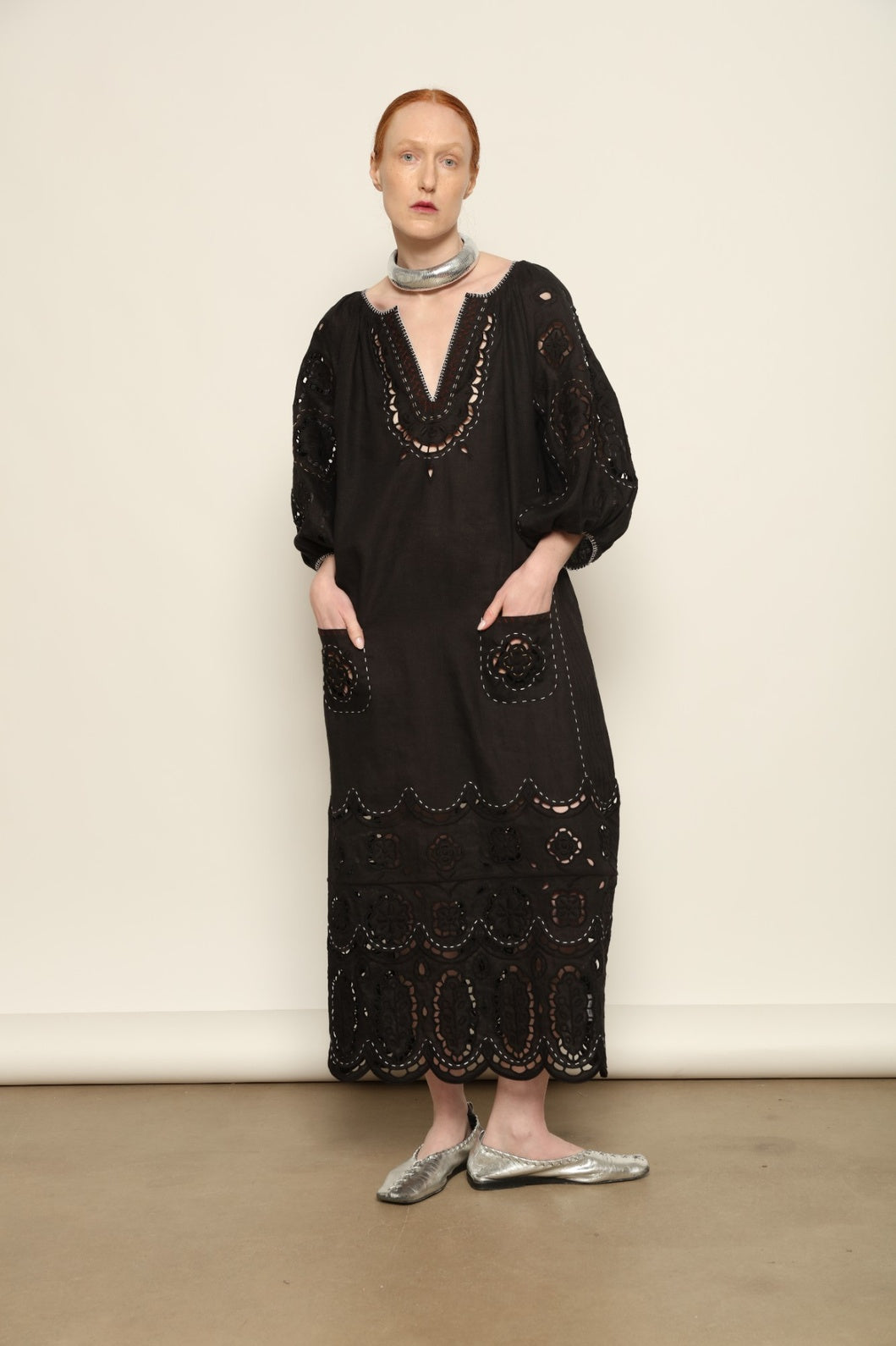 Model is wearing the My Sleeping Gypsy Merezhivo Long Dress, handcrafted from 100% linen with Richelieu embroidery and 24-carat bead accents, from the House of Nomad Stories selection.