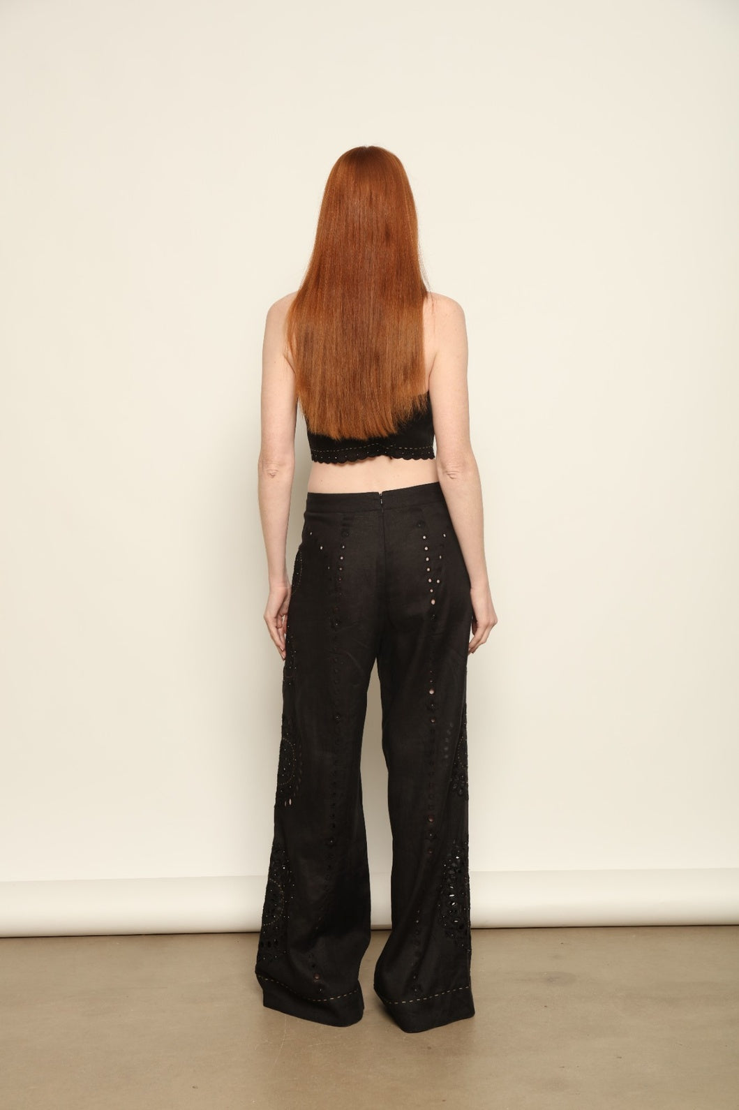 Model is wearing the My Sleeping Gypsy Sarah Long Suit, a handcrafted ivory linen two-piece with intricate embroidery and 24-carat bead accents, from the House of Nomad Stories selection.