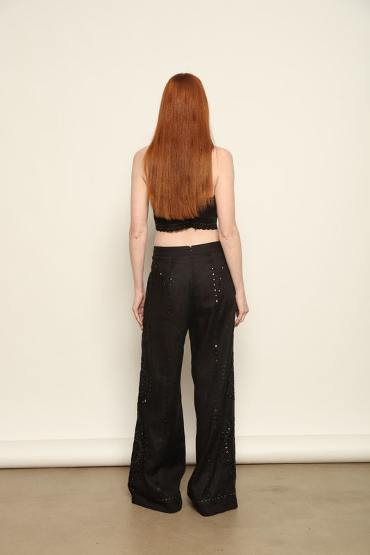 Model is wearing the My Sleeping Gypsy Sarah Long Suit, a handcrafted ivory linen two-piece with intricate embroidery and 24-carat bead accents, from the House of Nomad Stories selection.