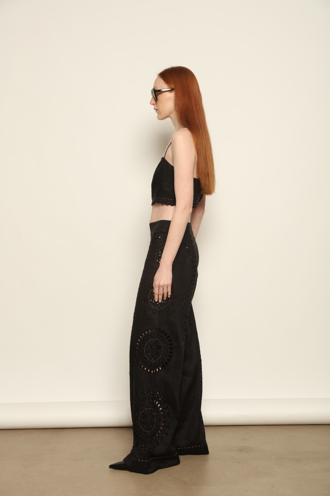 Model is wearing the My Sleeping Gypsy Sarah Long Suit, a handcrafted ivory linen two-piece with intricate embroidery and 24-carat bead accents, from the House of Nomad Stories selection.