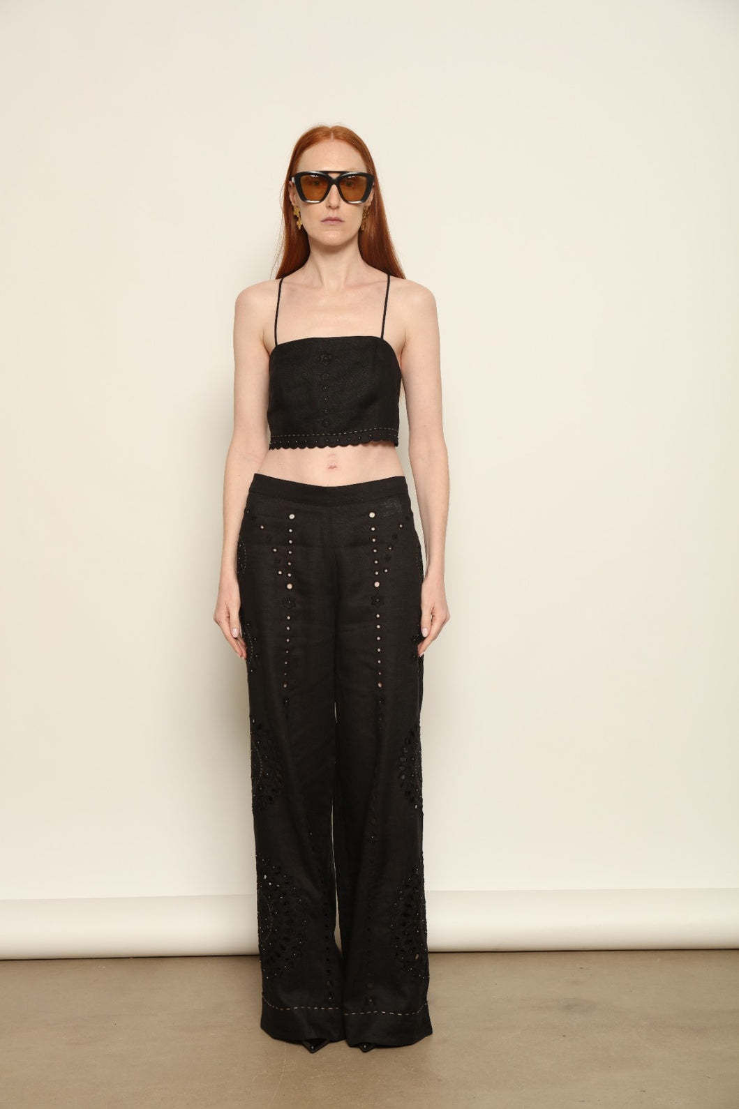 Model is wearing the My Sleeping Gypsy Sarah Long Suit, a handcrafted ivory linen two-piece with intricate embroidery and 24-carat bead accents, from the House of Nomad Stories selection.