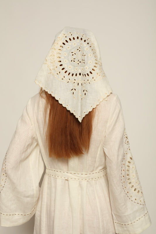 Model is wearing the My Sleeping Gypsy Slavia Head Scarf, handcrafted from linen with intricate embroidery inspired by Slavic heritage, from the House of Nomad Stories selection.