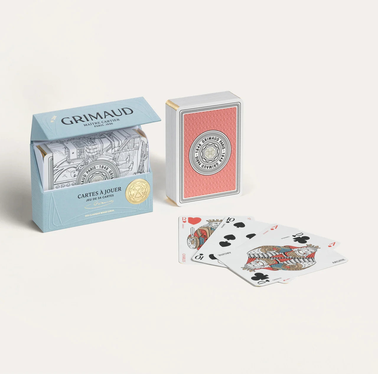 N°200 Cartes à Jouer by Grimaud Paris from the House of Woven Stories selection, luxury Bridge and Poker playing cards in Coral Red, made in France with gold foil detailing and illustrated design.