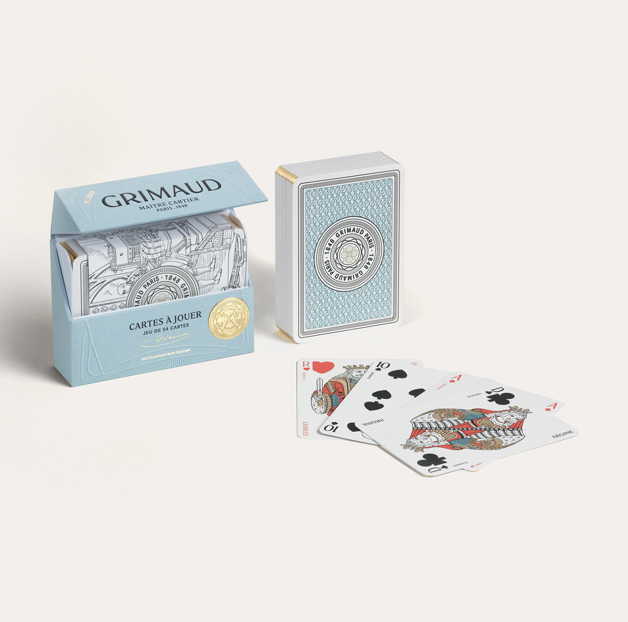 N°200 Cartes à Jouer by Grimaud Paris from the House of Woven Stories selection, luxury Bridge and Poker playing cards in Dolphin Blue, made in France with gold foil detailing and illustrated design.