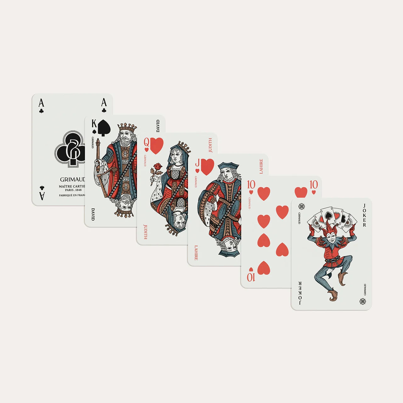 N°600 Cartes de Patience by Grimaud Paris from the House of Woven Stories selection, luxury solitaire playing cards in Coral Red, made in France with gold-gilded corners and illustrated design.