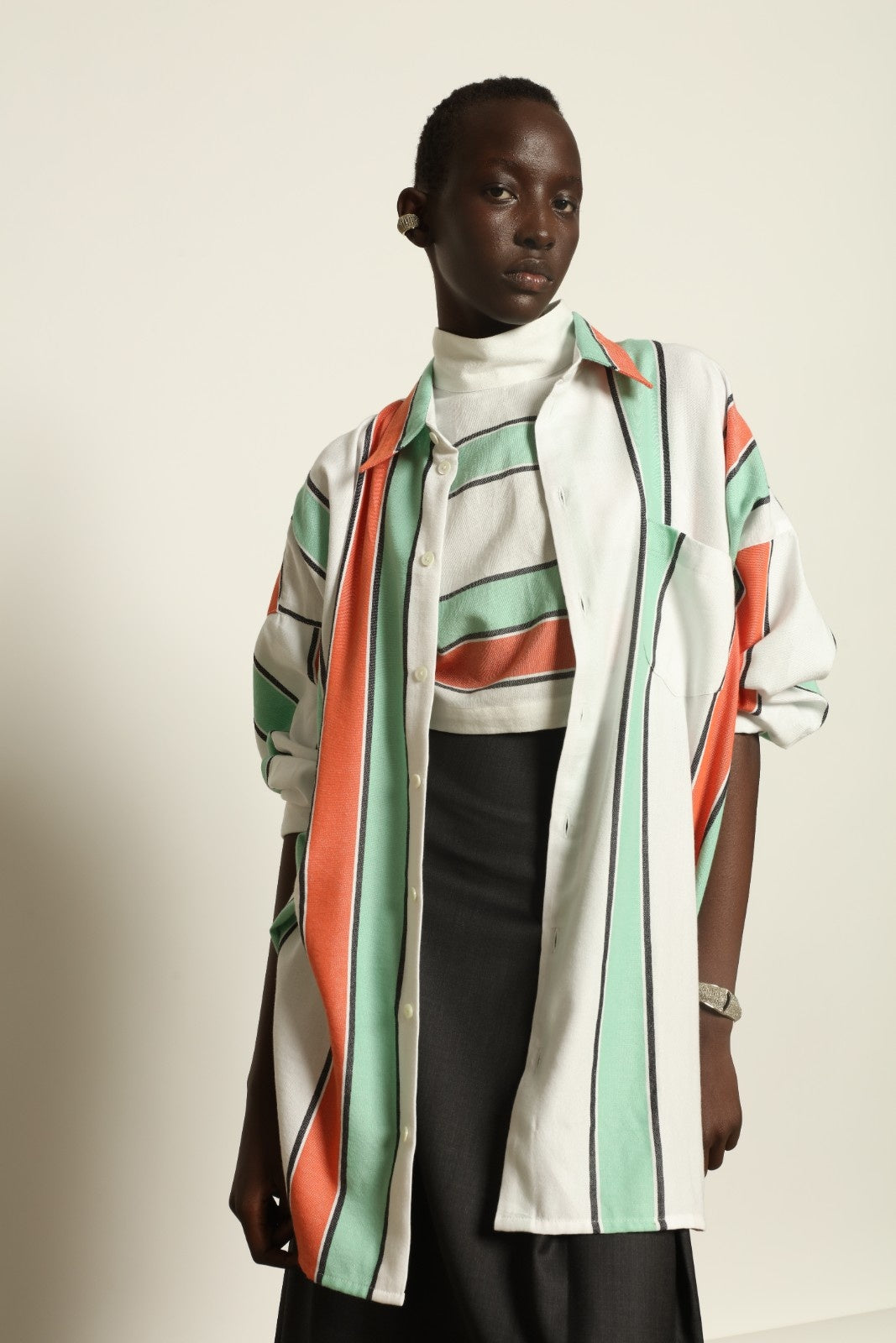 Model is wearing the Oversized Shirt with Collar by Marrakshi Life, part of House of Nomad Stories collection, handwoven cotton shirt with relaxed architectural fit, structured collar, and versatile styling